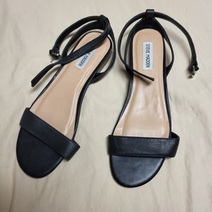 Black flat sandals with ankle strap